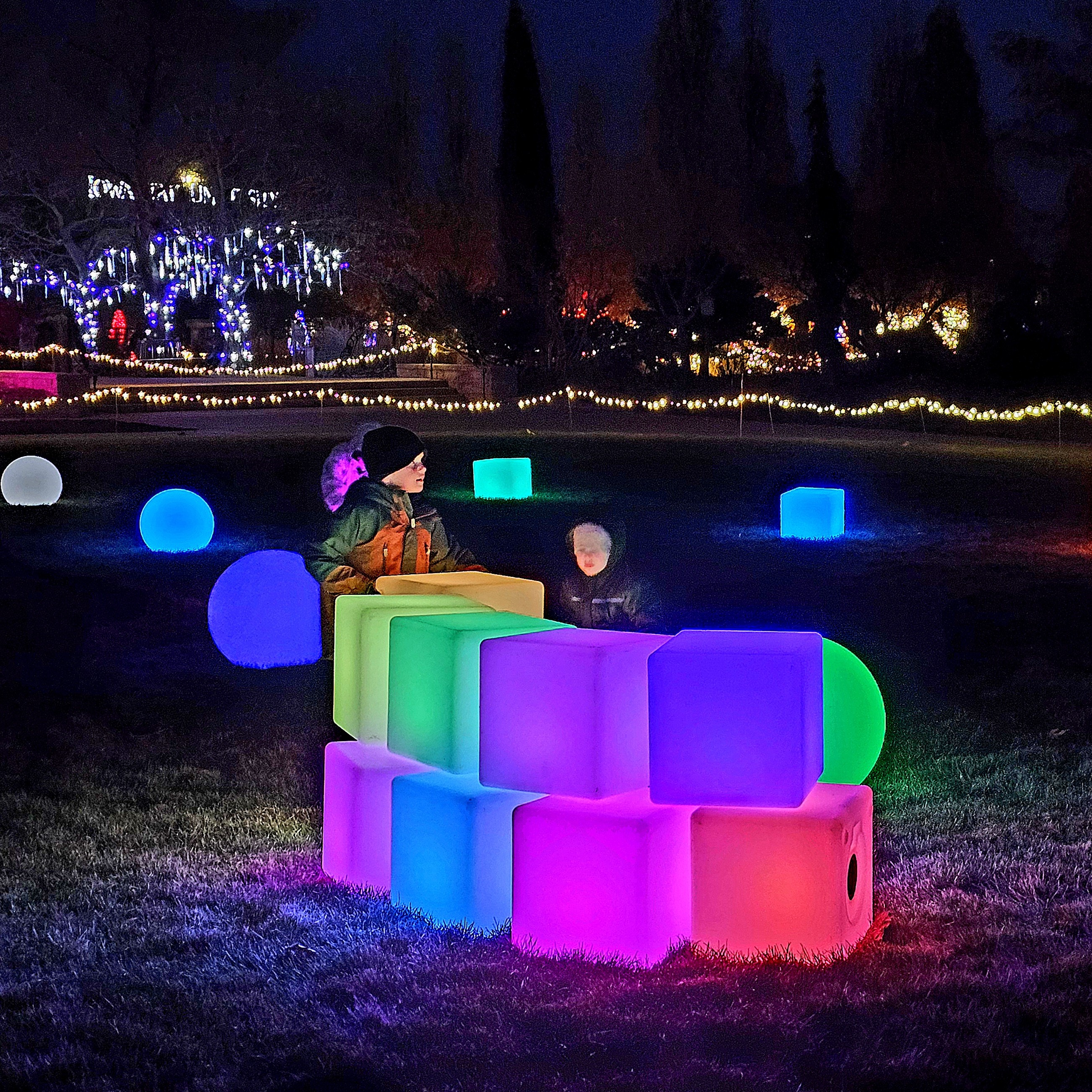 Children playing with lighted blocks